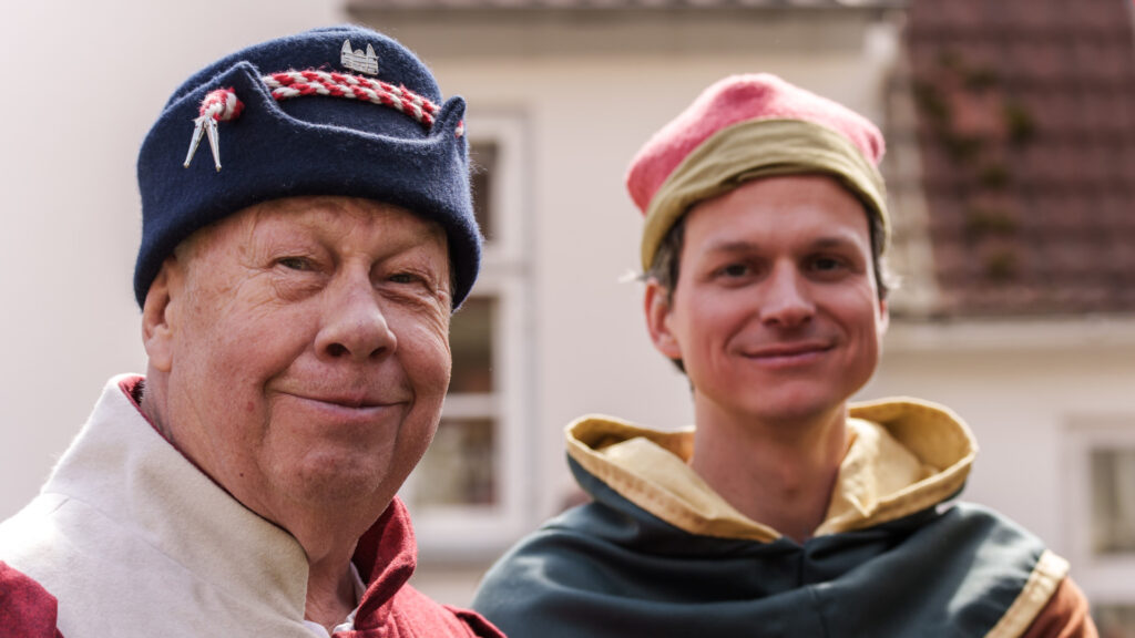 Mitglieder des Hansevolks lächeln in die Kamera